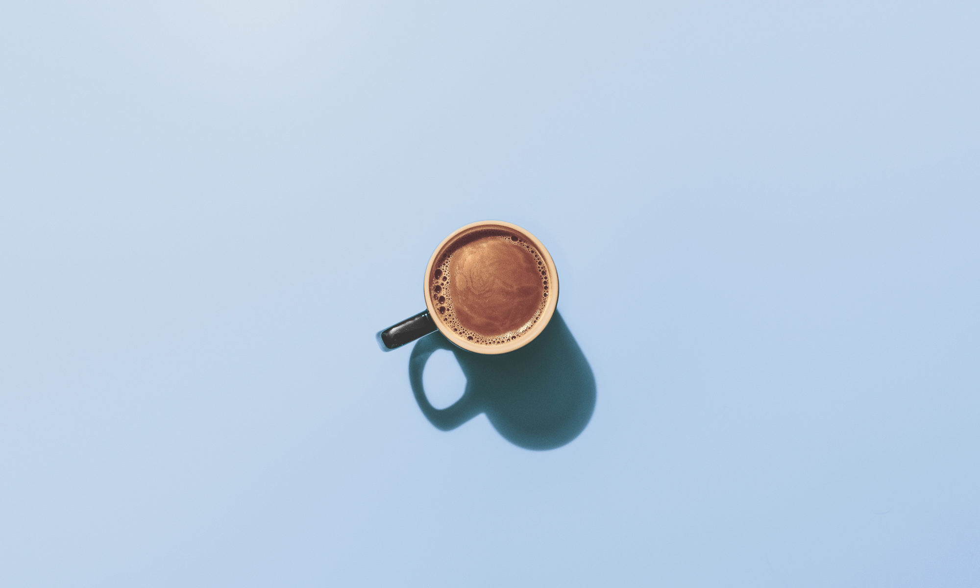 A cup of coffee on a blue background